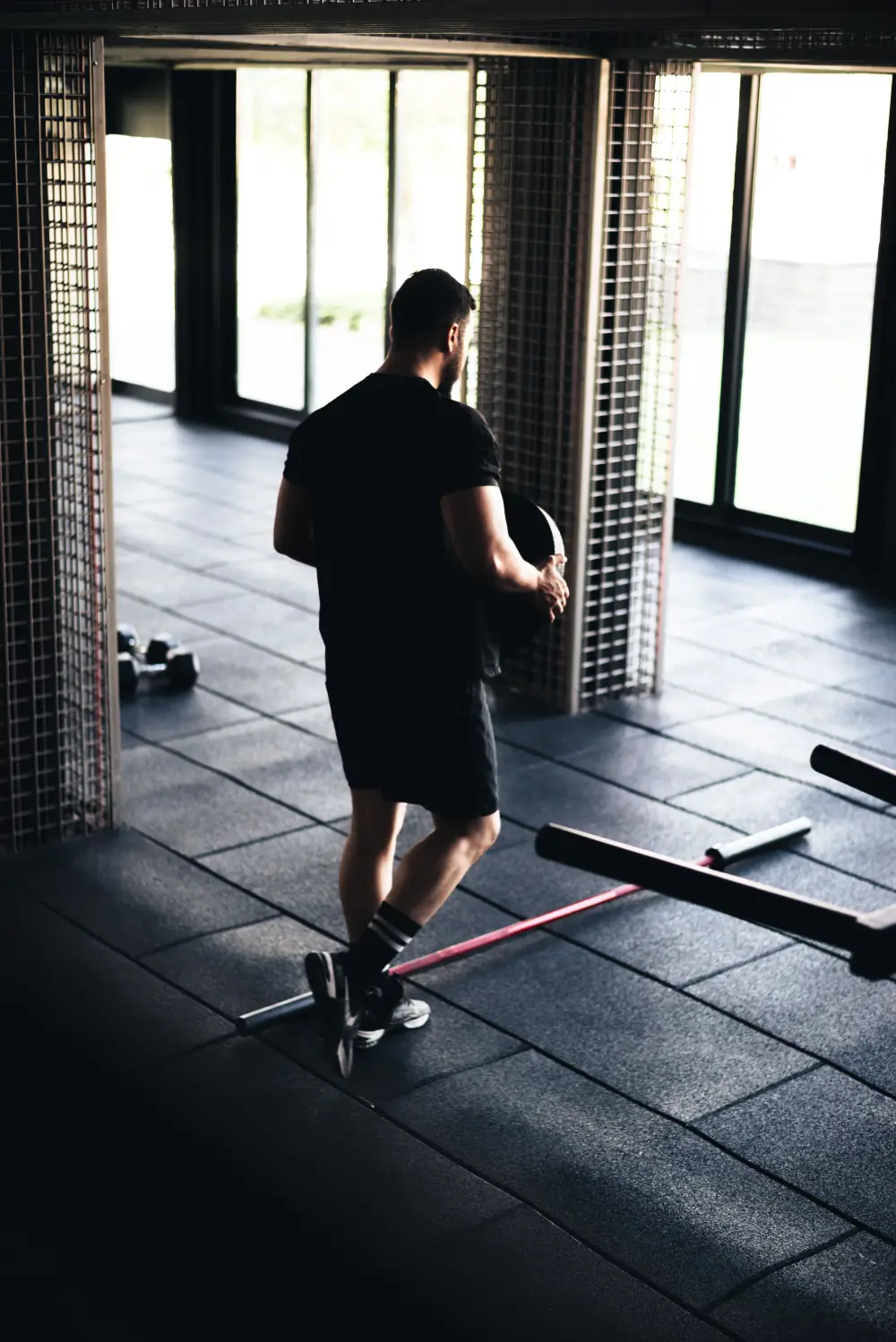 An athlete working against a resistance band in a gym